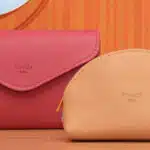2 pochette en cuire rose et saumon sur fond orange